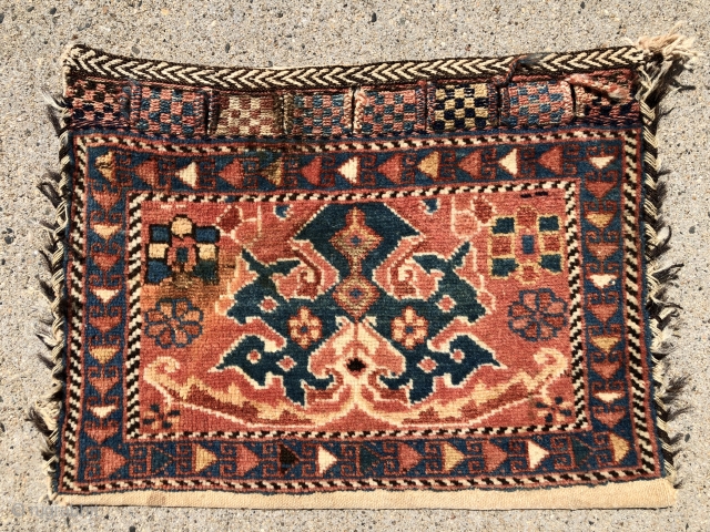 Antique little Persian Afshar complete bag with iconic design. Overall good pile and all natural colors. Original back and fancy closure tabs. Thumb sized brown stain in field as shown. Unlikely to  ...