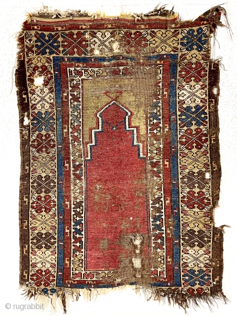 Antique Turkish village prayer rug. Early weaving ravaged by wolves. Priced accordingly. Mid 19th c. Or earlier. 3’2” x 4’3”             