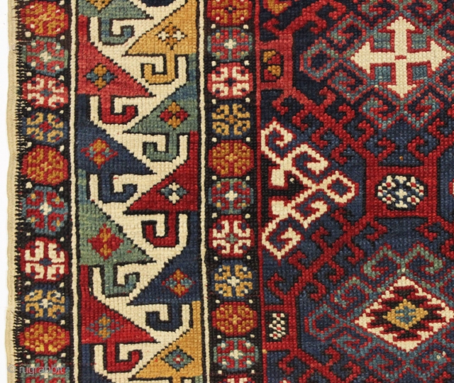 Antique very colorful little caucasian rug in good condition. Eye catching "dragons tooth" border. All good saturated natural colors featuring beautiful greens, multiple blues and nice old yellows and golds. Original selvages.  ...