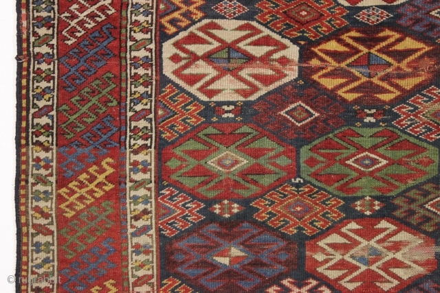 antique blue ground kazak with an allover design and a very unusual border. "as found", dirty with areas of wear as shown. Mostly fair even pile. Very fine saturated natural colors including  ...