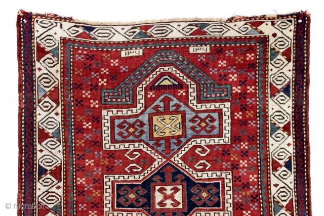 antique little kazak prayer rug. Interesting design featuring an eye catching border. All natural colors. inscribed date. As found with wear and slight edge roughness as shown. Restorable. Good age, ca. 1885.  ...