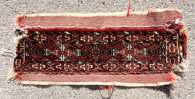 LAntique little turkman weaving. A mysterious small pile weaving. Fragment or incomplete object? Good even tight pile. Top and bottom with original red flat weave. Sides rough as shown with a bit  ...