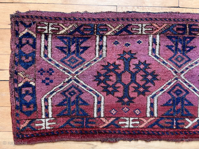 Antique turkman ersari torba with classic design. Good pile. Natural colors with deep purple field and yellow/orange highlights. Reasonably clean. 19th c. 
17” x 43”        