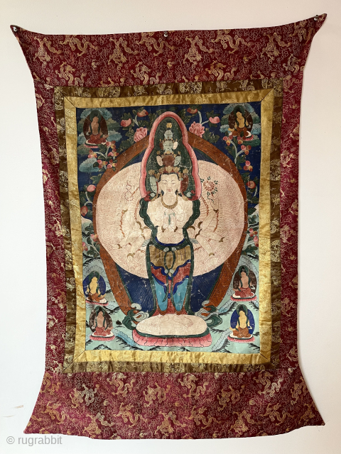 Old Tibetan thangka. Large and colorful. 
Old backing. Paint not flaking but years of abuse and folding with overall crazing. Not my area of expertise. Looking to close out shop inventory this  ...