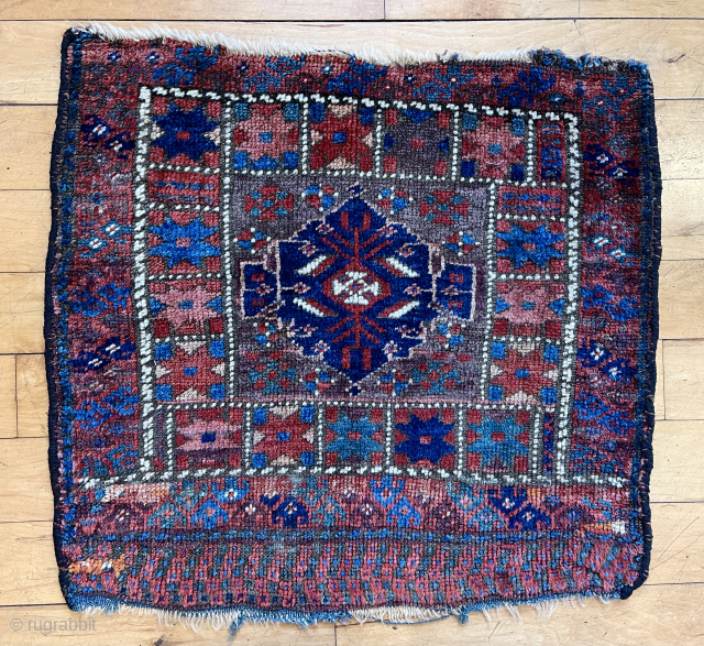 Antique bagface with an uncommon design usually described as Afshar. Overall pretty good condition with lovely colors. I like the stylized humans. Reasonably clean. 19th c. 23” x 24”
    