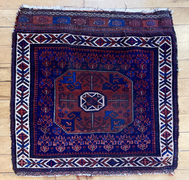 Antique large blue ground baluch “octagon” bagface. All the bells and whistles of the type along with one unusual feature. The fish bone border and central octagon look white but they are  ...