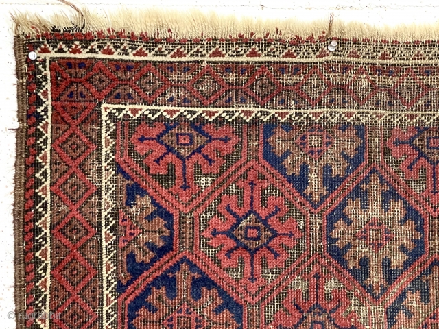 Antique small Baluch rug with a lattice or tile design field and a nearly completely oxidized ground. Good old natural colors. Overall fair condition for an older rug with some good pile.  ...