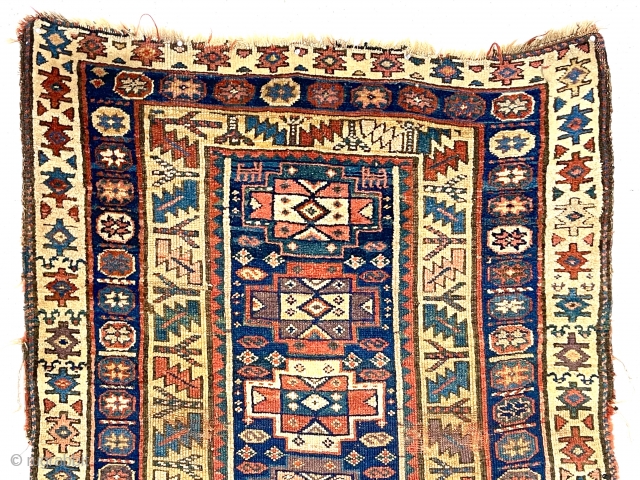 Antique northwest Persian Kurdish rug with a well known but uncommon older design. Pile varies from decent medium to very low with areas of wear showing foundation. All excellent natural colors featuring  ...