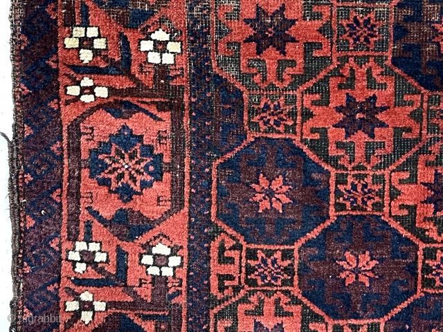 Antique small Baluch rug with classic lattice or tile design field and a lovely archaic floral meander border. Good weave and wool quality. Overall fair condition for an older rug with heavily  ...