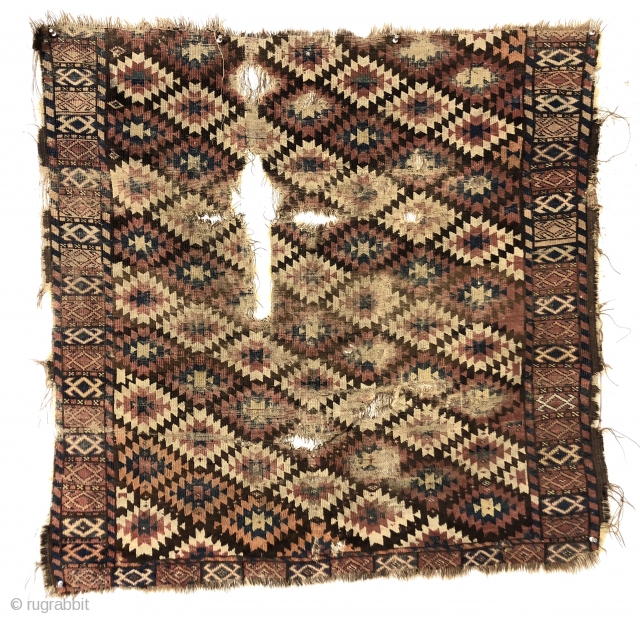 Antique unusual turkman rug fragment, perhaps chodor, with a tight lattice of ashik guls arranged in diagonal color rows on a dark brown ground. Persian knotted open to the right. Appears to  ...