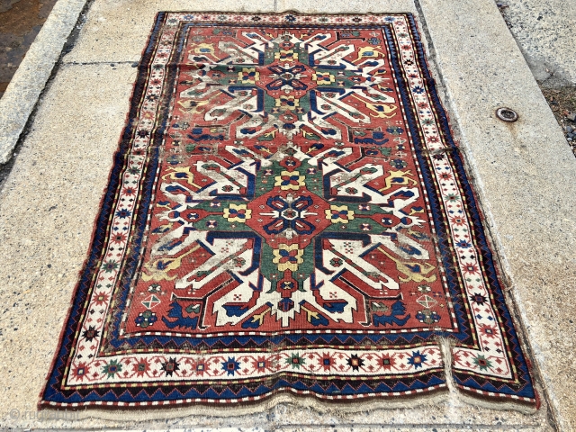 Early eagle karrabagh rug with outstanding color. Unfortunately in very rough condition. All excellent natural colors featuring brilliant yellows and greens. Wear and scattered damage as shown. Some old crude flat stitch  ...