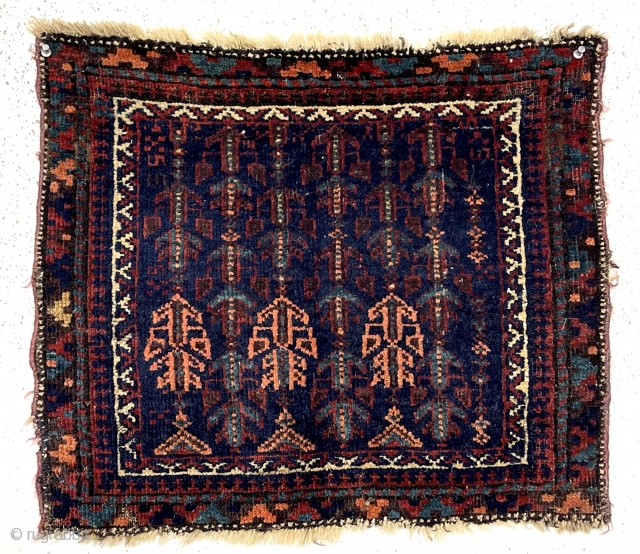 Antique little Baluch bagface with an array of unusual floral motifs on a rich blue ground. Good overall pile. All natural colors including nice light blues and a rich apricot orange. Selvages  ...