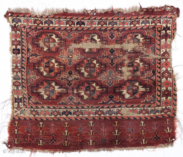 antique turkman yomud chuval. Older example unfortunately ravaged by wolves. Nicely drawn field and better than average elem panel. All natural colors. As found condition and priced accordingly. Ca. 1870 or earlier.  ...