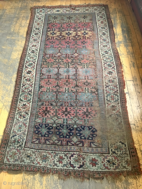 Old northwest Persian or Kurdish rug. Interesting field design and unusual border. As found, very very dirty with wear and edge damage as shown. Priced accordingly. Appears to have all natural colors.  ...