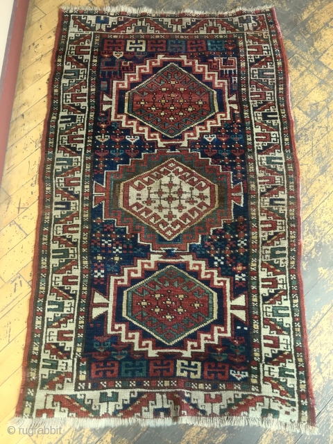 Antique kazak or Karabaugh rug. Interesting field. Fair condition. Even low pile. Good selvages. End loss as shown. Needs a wash. Charming little rug. Late 19th c. 3'3 x 5'5"   