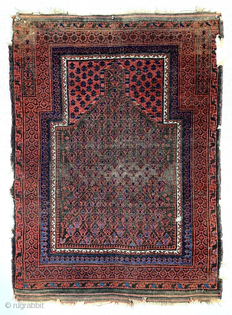 Antique Baluch prayer rug. Uncommon and interesting doktar I ghazi design. Overall fair condition for an older example. All good natural colors featuring lots of nice light blues. Decent even low pile  ...
