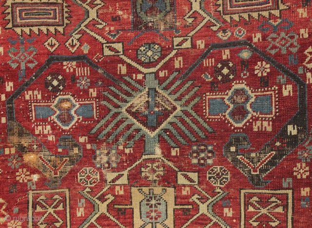 antique caucasian rug, probably shirvan. Local fresh find. Older variant of a well known design. The numerous endless knots are an interesting addition to the archaic main floral devices. "as found", very  ...