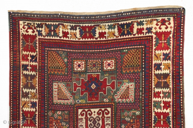 early large kazak rug with real green ground and an exceptionally colorful border. All splendid natural colors featuring beautiful greens, excellent reds, a nice aubergine and clear yellow/gold highlights. The extra attention  ...