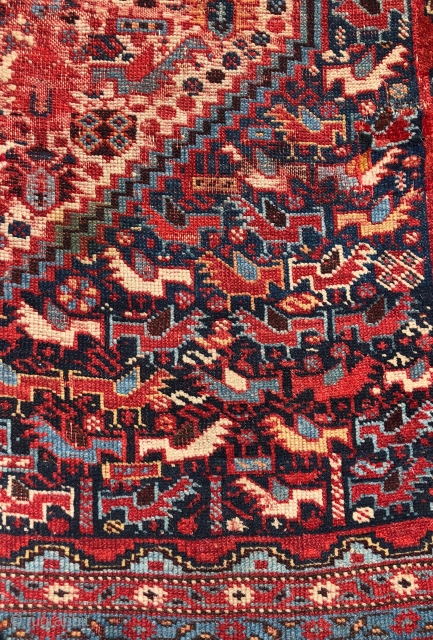 Antique south Persian qashqai small bird design rug. Flocks of beautifully colored little birds fill the field and ivory medallions. Pile varies from good even low to very low to none in  ...