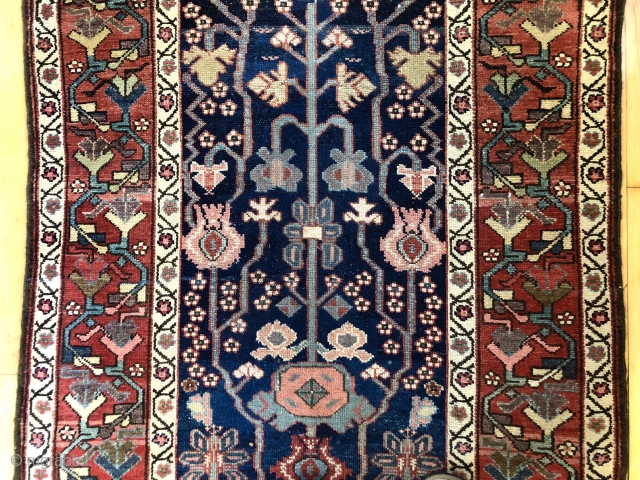 Antique northwest Persian runner with a lovely floral design field and border. As found, reasonably clean and in very good condition with even pile and good edges. All natural colors including fine  ...