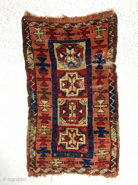 Antique Anatolian yastik. Bold drawing and vibrant natural colors. Remnant original selvages and some end kelim. Areas of wear and damage. Coarse weave. As one late colleague would say “this could be  ...