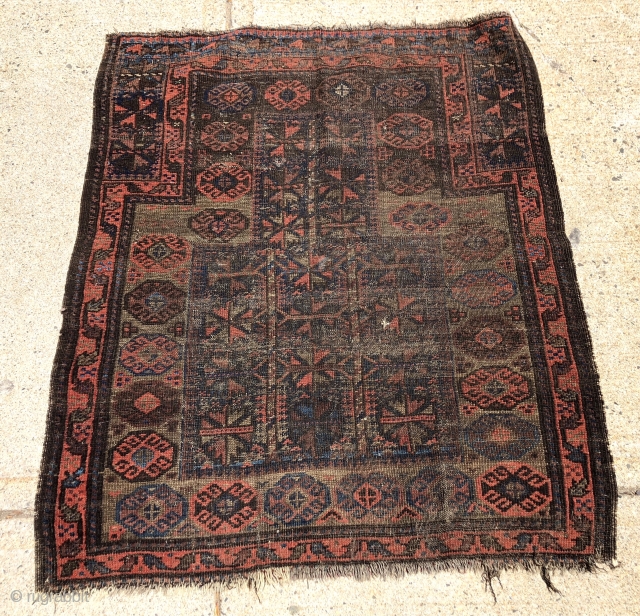 Antique Baluch prayer rug. Interesting somewhat unusual design but very worn and with heavy brown oxidation as shown. Priced accordingly. 19th c. 3’2” x 3’9”        