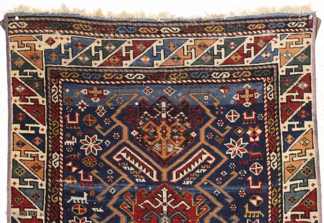 antique kuba rug. Fresh New England find. Interesting design with large tulip palmettes and a jungle of little animals. All good strong natural colors featuring a pretty abrashed medium blue ground and  ...