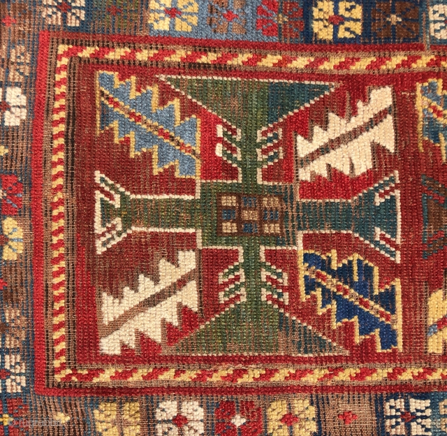 Early Kazak rug with an uncommon field design and an eye catching border. The best example of this type I have encountered. Beautiful old natural colors including lovely old greens. Overall low  ...