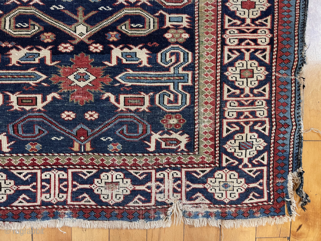 Antique Caucasian perpedil rug. Classic field with nicely drawn “Kufic” border. Good range of natural colors. Even low pile with scattered wear. Rough edges, gouges, small tears. Reasonably clean. Nice wall piece.  ...