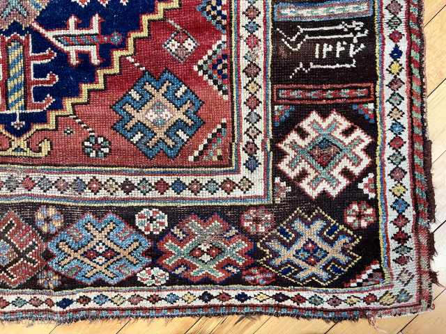 Antique good sized southwest Persian rug, unusually dated (1237?) possibly khamseh, in fairly good condition. Attractive design featuring a large green medallion and an interesting border with animals. Few small old repairs.  ...