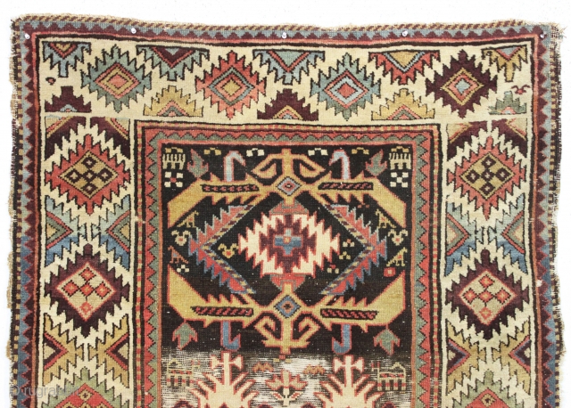 antique tribal long rug, probably nw persian. Interesting design featuring a very attractive bold border. "as found", very dirty with areas of heavy brown oxidation, wear, edge damage, a few stains, old  ...