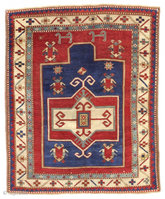 antique fachralo kazak prayer rug in overall good condition. Nice spacious drawing of this iconic type. All beautiful natural colors. Original edges and ends. I had a small stain repiled. Washed and  ...