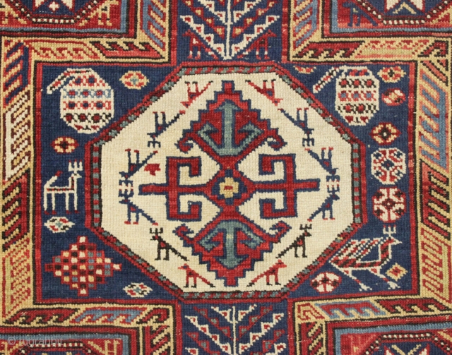 antique caucasian rug, probably shirvan, in pretty good condition with extra long keyhole style medallion and many charming animals. Overall fair even pile with good edges and ends. All good saturated natural  ...