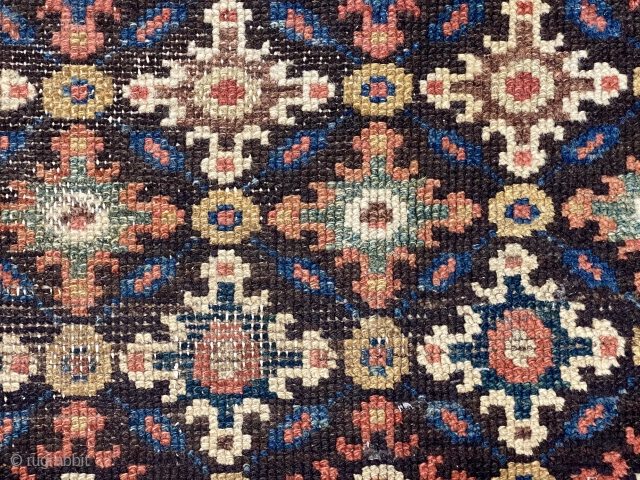 Antique rug fragment, possibly northwest Persian, with an interesting design featuring all over cloud band type motifs. Good natural colors. Good age, ca. 1880 or earlier. 32” x 39”    