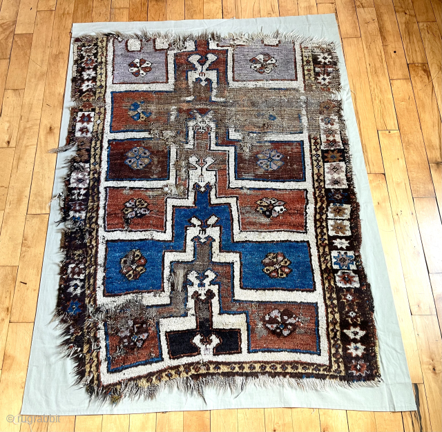 Early Turkish prayer rug fragment. Coarse and rugged. Lovely purple. First half 19th c. or earlier. 
43” x 55” not including cloth mounting.          