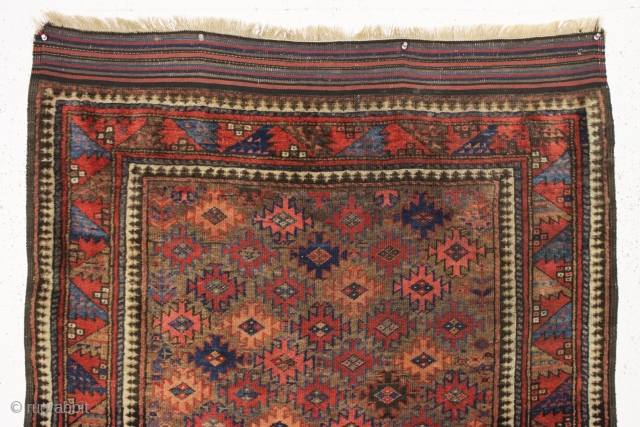 antique very colorful baluch rug with an attractive design featuring a very nice border. Overall mostly very good pile with just a bit of scattered light wear. I see one dime size  ...