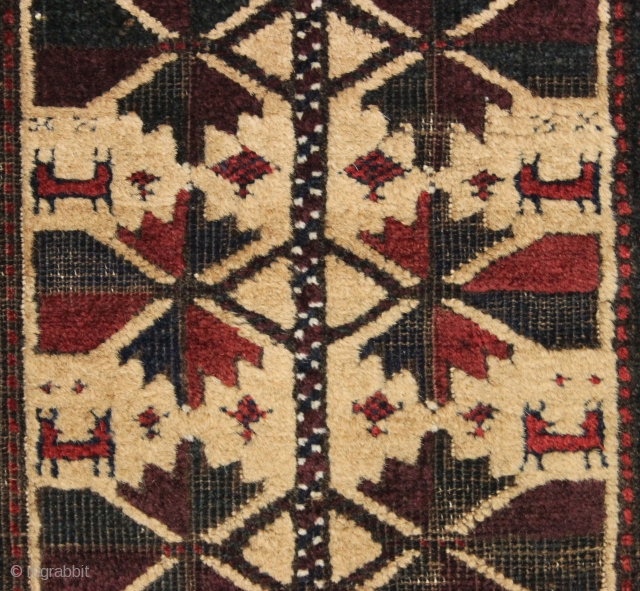 antique camel ground baluch balisht with well drawn animals. High quality wool. Corroded browns. Reasonably clean. Edges not original. Good age, ca. 1875. 18" x 36"       