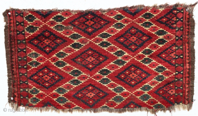 antique little turkoman ersari fragment with an interesting ikat type design. All natural colors featuring multiple reds deep green. Reasonably clean. Original goat hair 3 cord selvages. Good age, ca. 1880 or  ...