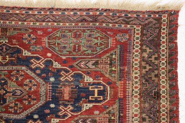 antique small soumak carpet. Classic design with some charming tribal elements including 12 rockects and 6 tiny people. Nice older example in good condition for the age. All natural colors featuring a  ...