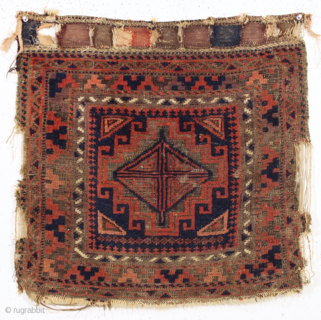 antique baluch bagface. Bold, somewhat unusual design. All good colors. Heavy brown oxidation. some wear and edges rough as shown. Original closure tabs. Reasonably clean but would look better after a good  ...