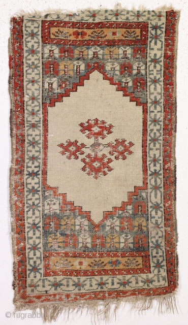 Antique little rug, probably turkish, with an attractive design and a pretty soft palette. "as found", dirty but in fair condition with heavily oxidized blacks as shown. Not a great collector piece,  ...