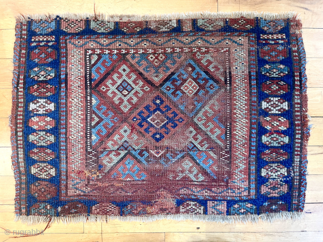 Old jaf Kurd diamond bagface. Interesting field with a design change in both border and field. Low pile with areas of heavy wear and end unraveling.
Needs a good wash. 19th c.
22” ...