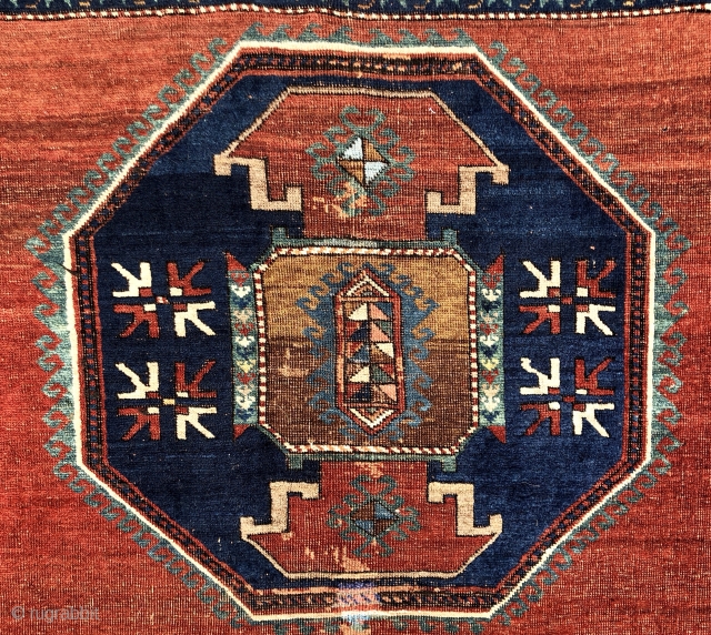 Antique large Caucasian rug with some unusual features. Although presumably Kazak, possibly Armenian, with Lori Pombak medallions. The rug has unusually open drawing and is fitted with a very  delicate floral  ...