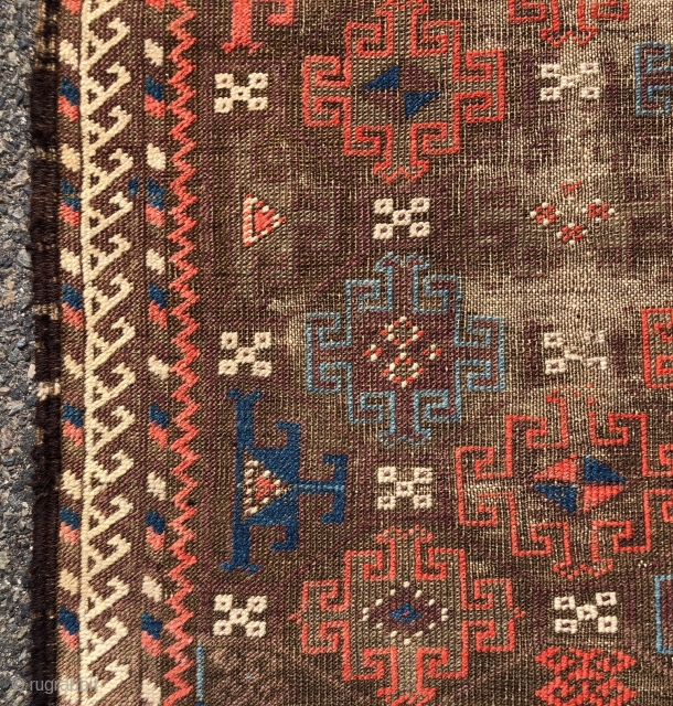 Antique small Baluch rug with an archaic spacious memling gul design and vivid old colors. Al natural colors including strong reds and eye catching light blues. Overall low pile with heavy oxidation  ...