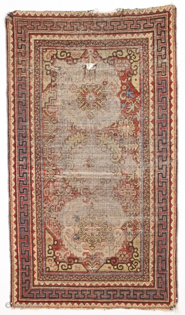 antique khotan rug with an interesting design but in poor condition. As found, dirty with old good colors and heavy wear as shown. Study piece for the east Turkestan aficionado? mid 19th  ...
