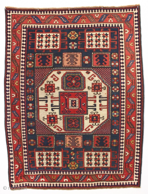 early blue ground karachopf kazak. Classic overall form but some unusual and idiosyncratic elements and colors. Interesting border drawing. All natural colors including a good old purple, nice clear yellows and a  ...