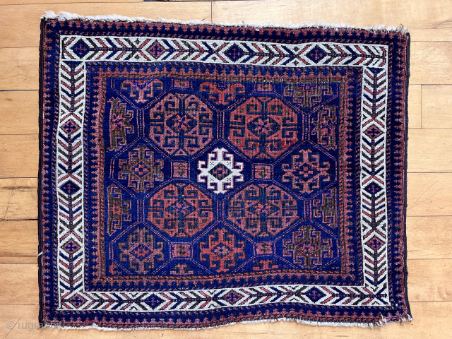 Baluch are hot again. Classic tile field and fish bone border, my favorite. Good age. 19th c.  24” x 28”            