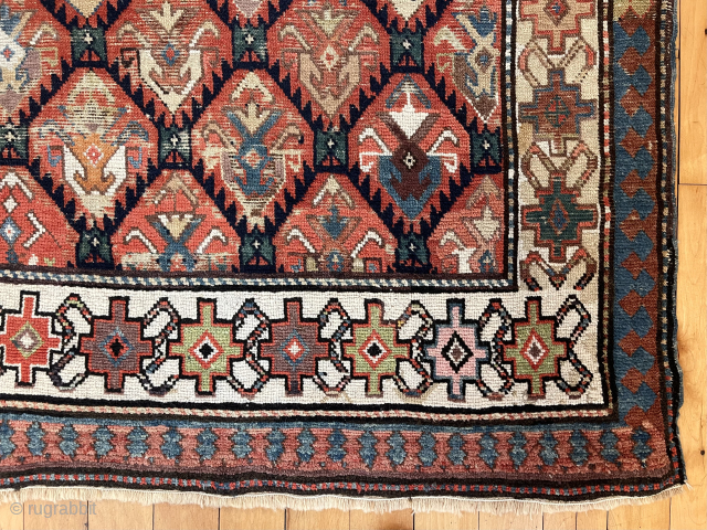 Lovely old long rug with all over tulip palmette design field. Fresh New England find with old cleaning tag from 2005. Scattered wear as shown. No holes. I see some very small  ...