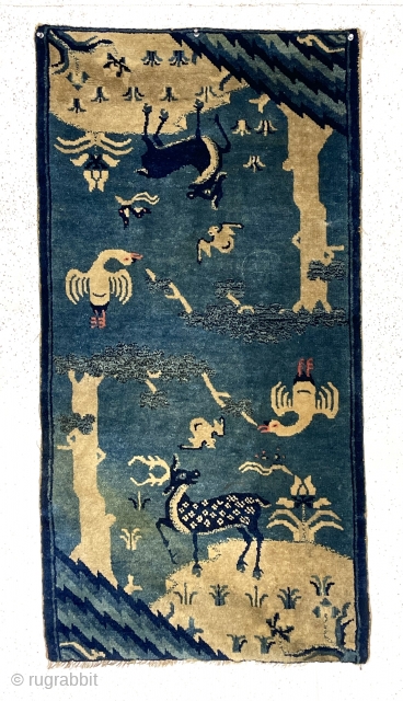Outstanding diminutive antique Chinese rug. Great double landscaping fantasy with charming flora and fauna. My assumption this weaving is meant to be hung over a chair back or some similar furniture to  ...