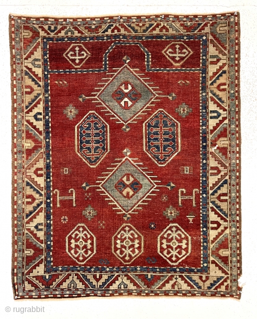 Antique bordjalou Kazak prayer rug. Attractive reasonably early example with spacious drawing. All natural colors. Overall even low pile. Small corner edge gouge and I see a small tear/hole probably old moth.  ...